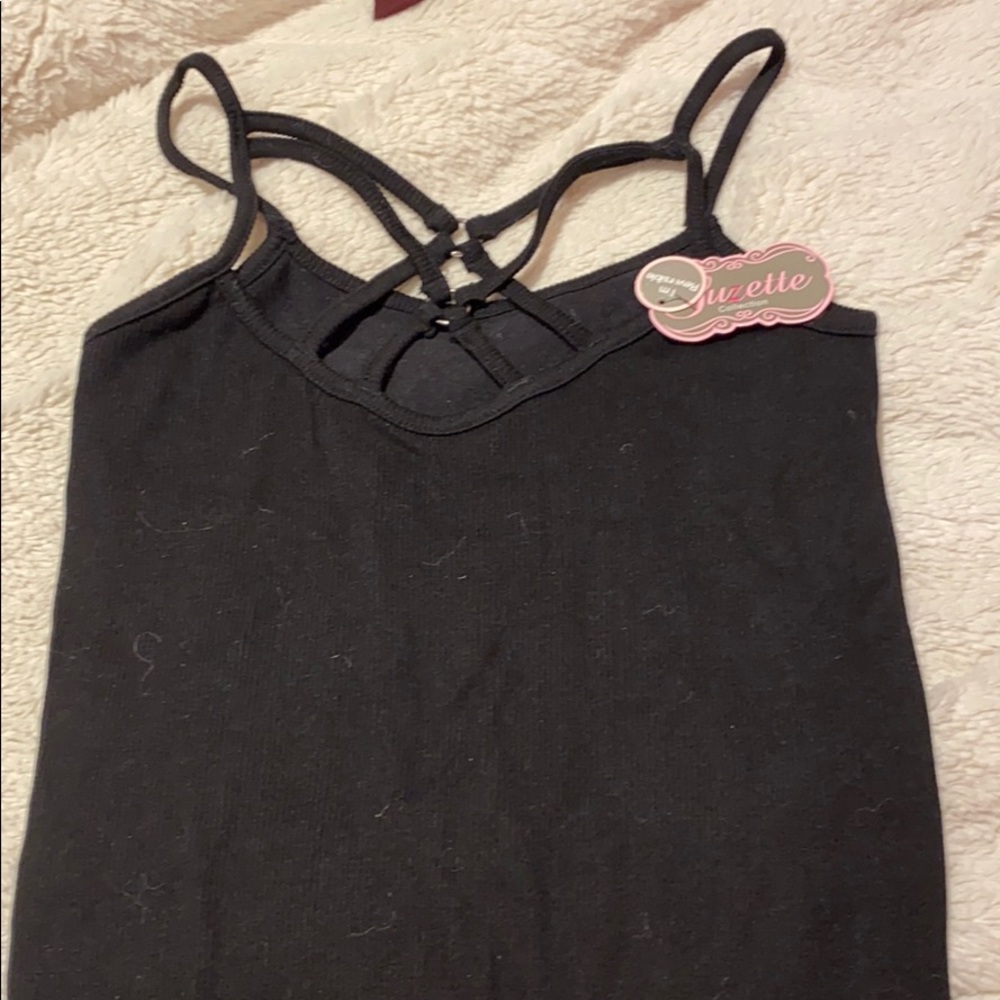 Black (Criss cross) tank top. Sold at Denny’s.